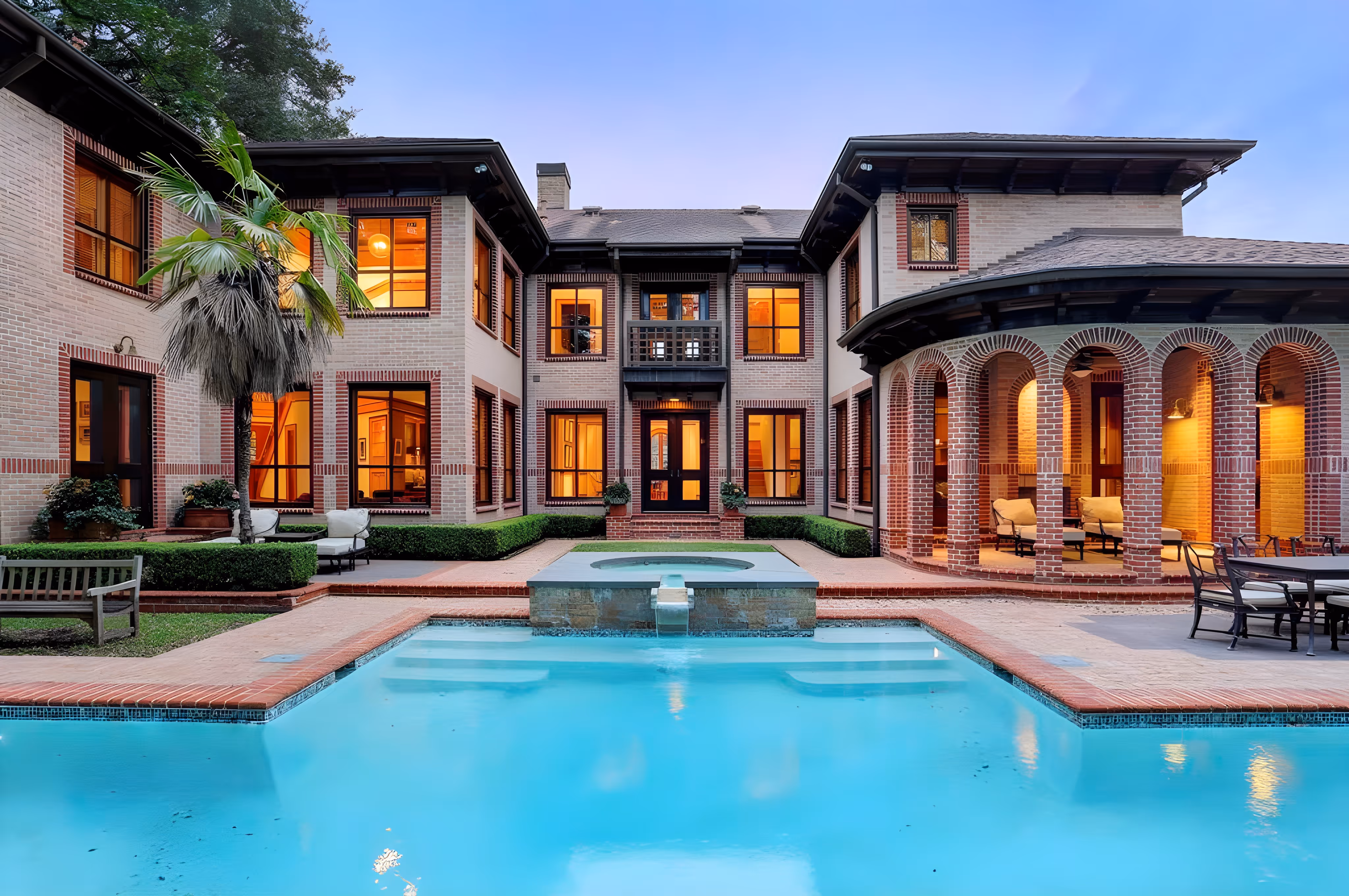 Backyard view of home with large pool.